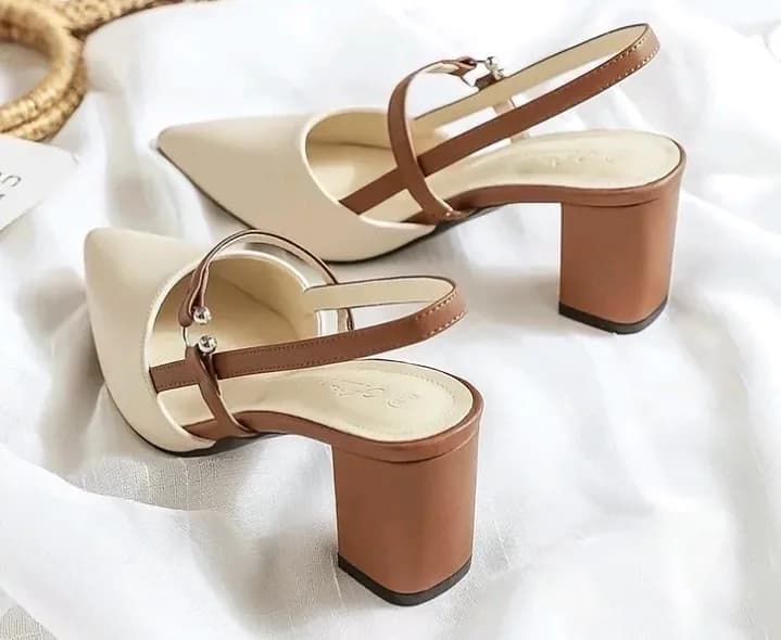 Step into effortless style with these two-tone slingback block heels! Designed with a sleek pointed toe and contrasting tan straps, they offer the perfect balance of elegance and all-day comfort. 😜✨